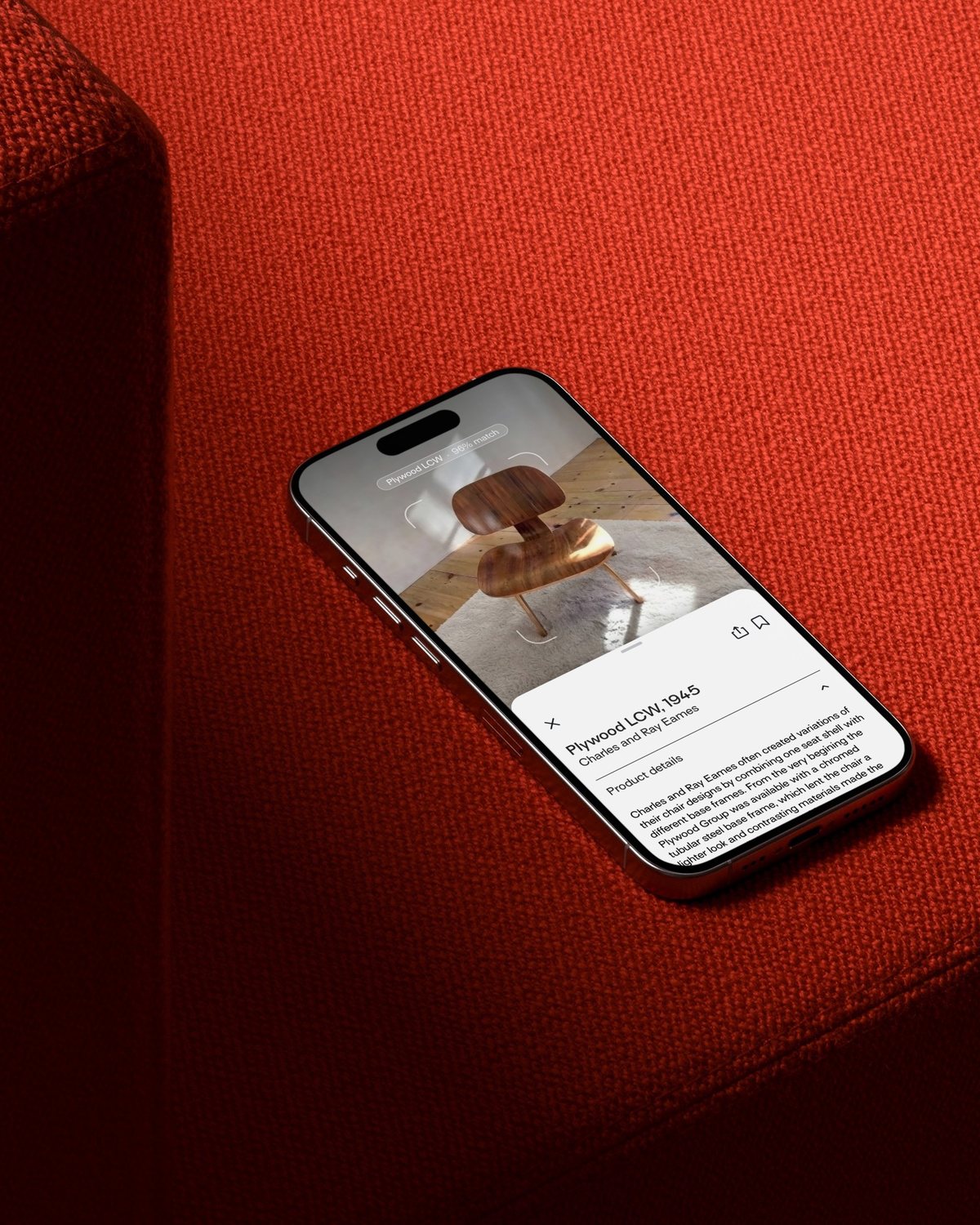 Product app on a smartphone, on a red sofa